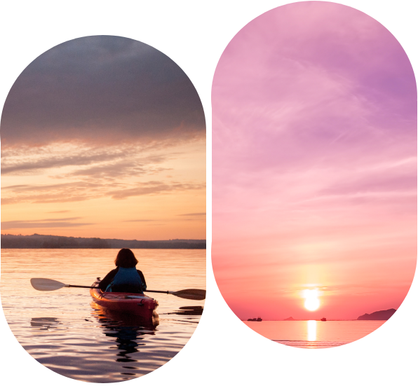 A person in a kayak on the water at sunset.